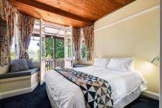 24 Lawrence Street Blackheath NSW 2785 $1,350,000 - $1,485,000 Occupying an elevated position, with a nor-easterly perspective, in one of Blackheath's tightly held and whisper-quiet streets, this beautiful 1930s character home boasts privacy, space, gentle renovation and exciting further potential. There are two separate titles, and with each block being approximately 695sqm, there is scope to introduce a second dwelling (STCA) if desired. With retained period features, the high ceilings, wraparound verandah, wood floors and timber panelling arrest attention on arrival. With thoughtful renovations throughout, the home offers versatile and functional living spaces, whilst still retaining timeless mountain charm. This address offers peace, space and polished comfort in a location connected to nearby bushwalking trails, village amenities and city transport links. This three bedroom, two bathroom beauty is truly out-of-the ordinary and boasts excellent indoor/outdoor connections from multiple angles. Life here has the potential to offer relaxed, meditative mornings and exciting social gatherings taking advantage of the various gardens 'rooms'. This is the perfect example of getting the balance right for those seeking the revered mountain lifestyle. Breakdown of Features: Retained 1930s period high ceilings; wood floorboards; timber panelling Beautifully light-filled open plan living/dining/kitchen with island bench Slow combustion wood burner in living area; ducted gas heating throughout Multiple indoor/outdoor transitions; multiple spaces for alfresco entertaining Three bedrooms; master retreat with shower ensuite and scope to remodel Luxury bathroom with spa-like feel, huge walk-in shower and deep bath Separate powder room WC; large internal laundry; additional store cupboard Single lock-up garage; established garden 'rooms' offering peaceful privacy Approx 1.4km 20 min stroll or 4 min easy drive to all village amenities