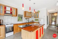 66 Mollison Street Malmsbury VIC 3446 $940,000 - $980,000 In the heart of Malmsbury, where tree-lined streets meet village charm, 66 Mollison Street offers something truly special - a rare pairing of past and present on a generous 3,370 sqm allotment. At the front, the original mid-1800s residence - once the local doctor's surgery and dispensary and home to Dr Edward Davy - still carries its stately presence. With its triple-brick construction, arched windows and solid foundation this grand old building brims with authenticity. Inside, the scale and proportions are remarkable, ready to be enjoyed now while also offering exciting potential for those with vision to further restore or enhance. To the rear, a newly built double-storey addition brings modern comfort into the mix. Polished concrete floors, double glazing and split-system heating and cooling make it an inviting, low-maintenance space that blends easily into its leafy surroundings without stealing the spotlight. There's also excellent shedding with its own frontage onto Mollison Street - a practical and versatile inclusion, ideal for trades, studio use or additional storage. Together, the two dwellings and shedding (powered 4 car and workshop spaces) form a distinctive lifestyle property - historic character at the front, contemporary liveability at the back and plenty of space to spread out in between. All within walking distance of Malmsbury's cafés, botanic gardens and train station and primary school. The extensive garden offers hidden nooks and pathways set amongst flowering plants and taller foliage including a spectacular large oak tree, established orchard and vegetable garden. Whether you're seeking a home with heritage appeal, an inspiring live-work setup or simply a slice of Macedon Ranges history with room to grow, 66 Mollison Street delivers space, soul and story in equal.