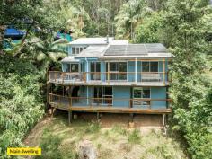 35 Domville Road Otford NSW 2508 $1,900,000 - $1,950,000 Nestled among towering gums in one of Otford's most peaceful pockets, this beautifully refreshed family retreat combines modern upgrades with flexible living. Offering a newly renovated kitchen, updates throughout, and a freestanding two-bedroom granny flat, this unique property caters to multi-generational households, investors, home-business owners, or families seeking space, privacy, and nature. Elevated above the treetops, the home captures soothing views across native bushland, with sunlit decks inviting you to relax, entertain, and take in the sounds of birdsong. With level access to the granny flat and a quiet position moments from the train, school and beaches, this truly is a rare lifestyle opportunity. YOUR HOME • The newly renovated kitchen is stylish and contemporary, featuring quality appliances, stone benchtops, and modern cabinetry, perfectly positioned next to the dining and deck areas for seamless entertaining. • Split-level design offers a versatile floorplan with four bedrooms, multiple living areas, an office, and three bathrooms. • Multi-purpose lower level featuring its own kitchen, bathroom, private entrance and deck; ideal for a teen retreat, guest accommodation, short-term rental, or home office/studio. • Enjoy the warmth of a low-emission wood burner in winter, plus reverse-cycle air conditioning for year-round comfort. • Large sun-filled verandahs and decks overlooking native trees and wildlife-a private sanctuary to unwind or host gatherings. • Double garage with private driveway entrance. • Totally independent granny flat with two-bedrooms, full kitchen, stylish bathroom, private entry and separate utilities.Perfect for long-term tenants, holiday letting, extended family, or home-based professionals. • Generous 930m² block provides privacy, space to explore and separation of granny flat from the main home. YOUR LIFESTYLE • Effortless commute with Otford Station a short walk away, with direct services to Sydney (approx. 1 hour) and Wollongong (approx. 35 minutes). • A short drive to Helensburgh for shops, cafés, restaurants, supermarkets, medical services, sporting facilities and the renowned mountain bike trail. • Otford Primary School is only a few minutes' stroll, loved for its nurturing community ethos. • Minutes to Stanwell Park Beach, Bald Hill Lookout, Werrong and Bulgo walking tracks and the Royal National Park-perfect for outdoor lovers. This is more than a home-it's a lifestyle immersed in nature, offering space, income potential, and peaceful living within easy reach of the city. Make your escape to 35 Domville Road, Otford.