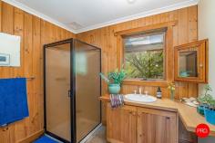 23 Strawhorn Court Kyneton VIC 3444 $950,000 - $1,045,000 If you've ever pictured yourself waking up to water views, wandering through and sipping coffee, watching kangaroos, as the morning mist lifts off the dam, this is your moment. From every room, there's a view worth framing, mesmerising outlooks that shift with the light, from rippling reflections on the water to the lush greens of the garden. You'll hardly need artwork when nature's doing the job for you. Inside, the cabin wraps you in warmth and charm. Think cove timber-lined ceilings, polished concrete floors and that wonderful mix of rustic texture and relaxed style. A crackling wood heater in the lounge sets the tone for winter nights, while split system heating and cooling keeps things perfectly comfortable year-round. The kitchen enjoys the same calming outlook, making every meal a moment to savour. The living spaces invite you to slow down, settle in and soak up the peace. Outside, it's pure magic. Expansive lawns down to the water's edge, incorporating beautiful established European shade trees and gardens that create a sense of timeless calm. Behind the dam, a pocket of bushland invites an easy afternoon wander for nature lovers or a playground for children, with the dam itself alive with yabbies and turtles, and spaces for collecting wood for the fire, family and friend gatherings, or quiet nights under the star-filled skies by the fire-pit. There's shedding with a carport, a woodshed, water tanks and solar, everything you need to live comfortably and lightly. It's relaxed, it's inviting and it's got that rare kind of charm that feels like a deep breath out. Whether it's your weekend hideaway or your forever escape, this one's all heart.