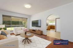24 Bellevue Rd Bellevue WA 6056 $725,000 This solid 1975 brick-and-tile home sits on a generous 680-square-metre block zoned R20/40, offering immediate liveability with genuine potential for those who see beyond the mauve bathroom tiles. The bones are good, the layout works, and there’s space to move – both inside and out. A powered workshop, substantial verandah, and private backyard complete a package that rewards practical thinking. 4 bedrooms, 1 bathroom 1975-built brick and tile Well-proportioned living Open-plan kitchen meals 6 m x 6 m powered shed Private fenced backyard 16 m x 3 m rear verandah Drive through BY access Zoned R20/40, 680 sqm lot 15 minutes to Perth airport The formal entry from the tandem carport leads through an arched doorway into an air-conditioned lounge room that’s surprisingly light and well-proportioned. Timber-look floors underfoot and a picture window overlooking the backyard create an airy feel that belies the home’s modest street presence. The open-plan kitchen and meals area continue the functional approach. Timber-look cabinetry, laminated benchtops, and an integrated breakfast bar define the cooking zone, which is fitted with an electric oven, new dishwasher, never used and a built-in pantry. Nothing revolutionary, but everything you need is here and sensibly arranged. The meals area accommodates a proper dining table with room to move, and the outlook to the backyard makes morning coffee feel less rushed than it probably is. Four carpeted bedrooms branch off a central hallway in classic 70s fashion. The main bedroom comes with air-conditioning, a ceiling fan, and a wardrobe, providing a comfortable retreat. One of the junior rooms includes a robe recess. The shared family bathroom embraces its era with mauve fixtures and tiles that someone, somewhere, is now paying premium prices to recreate. A separate WC sits off the walk-through laundry, a practical arrangement that eliminates morning bathroom queues. The backyard is where this property distinguishes itself. Double gates at the rear of the tandem carport provide drive-through access to a 6-metre by 6-metre powered workshop tucked into one corner – a space serious enough for projects, storage, or tinkering. A row of trimmed fiddlewood trees lines the rear boundary, their canopies creating a green screen that erupts with fragrant flowers come spring. The fully fenced lawn extends from an 16-metre verandah running the full width of the home’s rear, providing multiple zones for outdoor living. Palm trees frame a partially enclosed gazebo that previously housed a spa but reads more readily as an outdoor kitchen in waiting. Add a barbecue, some string lights, and comfortable seating, and you’ve created the kind of entertaining space that keeps people outside long after the sun sets. The privacy here is genuine – the kind where neighbours exist but don’t dominate your sightlines. The R20/40 zoning adds another dimension to the proposition. For those who see this as a long-term hold, there’s development potential. For those who want space now, the 680-square-metre block delivers elbow room. The location offers practical advantages too – Perth Airport sits roughly 15 minutes away via direct highway access, making early flights less punishing than they might be from elsewhere. This isn’t a home that will seduce you with European appliances or Instagram-ready interiors. It’s a solid, honest property that works now and offers options for later. The reward here is space – to live, to work, to potentially develop – at a point where space itself has become a luxury. For buyers who value function over fashion and see potential where others see only bathrooms that time forgot, this represents genuine opportunity.