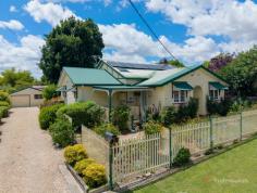 165 Markham Street Armidale NSW 2350 $750,000 - $795,000 Rich with period charm and a warm, welcoming presence, 165 Markham Street delivers an exceptional lifestyle in one of Armidale’s most sought-after central pockets. Beautifully maintained and full of personality, this home offers generous proportions, inviting indoor and outdoor living spaces, and the timeless character features buyers love in this location. Behind the classic picket fence and cottage gardens, the home opens to polished timber floors, decorative ceilings, dado rails and charming period details. The spacious front living room enjoys excellent natural light, while the country-style kitchen features an island bench, dishwasher, and abundant storage —perfect for everyday functionality. There are four well-sized bedrooms, including a lovely master suite complete with its own private ensuite and a walk-in cupboard. The home also offers a beautifully styled main bathroom with spa bath, plus a convenient separate toilet in the laundry. Thoughtful upgrades ensure year-round comfort, including ducted heating and cooling, solar panels, and a brand-new roof, providing peace of mind and improved energy efficiency. OUTDOOR LIVING THAT STANDS OUT A signature feature of this home is the expansive timber deck—partially covered, offering both sheltered entertaining and open-air relaxation. Overlooking the established gardens and fully fenced backyard, this space is perfect for family gatherings, BBQs or quiet evenings outdoors. Mature shade trees, garden beds and lush hedging create a private, tranquil feel. GARAGING & STORAGE The property includes a double-sized garage space with one side featuring a roller door and space for a vehicle, while the other half of the garage is currently set up as an additional workshop or storage area, providing excellent flexibility for tools, hobbies or extra space. KEY FEATURES: • Four bedrooms, master with ensuite & walk-in cupboard • Main bathroom with spa bath • Separate toilet in the laundry • Brand-new roof • Solar panel system for energy efficiency • Ducted heating and cooling throughout • Expansive timber deck—partially covered • Fully fenced yard with mature gardens and trees • Garden workshop • Stunning character features including timber floors & ornate detailing • Premium central position—walk to caf és, schools, parks & CBD