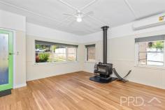 4 Mountain Avenue Batlow NSW 2730 $369,000 Positioned with an elevated aspect and boasting picturesque views, this solid home offers three bedrooms, large sun filtered living area with wood fire heating and split system air conditioning, great size kitchen and additional sunroom to the rear of the plan, all designed to capture the picturesque surrounds. You will love the space afforded in this three-bedroom brick home with low maintenance grounds on the aptly named Mountain Avenue. Do not miss your opportunity to secure such a solid home in the heart of the picturesque township of Batlow. Call or email today to book your inspection! Premiere Features: - Three bedrooms, two with ceiling fans - Bathroom with separate shower, separate bath, single vanity, wall mounted shaving cabinet and toilet - Large sun filtered lounge upon entry boasting wood fire heating, split system air conditioning and ceiling fan - Great size kitchen with slow combustion stove, electric cooktop, good bench space and cabinetry with an elevated aspect - Sunroom or dining with tiled flooring and a great view of the surrounding countryside - Mudroom area to the rear with a second separate toilet - Downstairs laundry - Front alfresco area - Single lock up garage with lighting and power - Additional woodshed - Good size fully fenced rear year with vehicle access - Approximate 841m² low maintenance allotment - Under house secure storage - Sash windows throughout