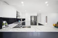 13 Durali Road Glenmore Park NSW 2745 $1,450,000 Move In, Show Off Welcome to 13 Durali Road, a spacious family haven designed for modern living, working and entertaining. This beautifully planned home offers multiple living zones including a large front lounge, open dining area and a central kitchen that connects seamlessly to the alfresco, while a second lounge complete with a built-in bar creates the perfect retreat for relaxed evenings or entertaining guests. A dedicated office at the front of the home provides the ideal work-from-home setup, and sliding doors open to a generous alfresco and additional rear patio, giving you exceptional indoor-outdoor living all year round. Upstairs, four well-sized bedrooms offer comfort for the entire family, with built-in robes to all and a private master suite featuring a walk-in robe and ensuite. With a double garage, excellent storage, functional design and plenty of room to grow, this is the complete family package in a highly sought-after Glenmore location; a home that delivers space, lifestyle and effortless comfort from the moment you arrive. FEATURES WE LOVE; • 4 spacious bedrooms including a master suite and sleek ensuite • 3 separate living areas ideal for families, entertaining & working from home • Designer kitchen with premium stone benches, appliances & ample storage • Modern bathrooms with high-end, luxe finishes • Dedicated bar/entertaining room with exposed brick feature bar, built with purpose • Split system air-conditioning throughout for year-round comfort • Double garage with fresh epoxy flooring • Immaculately maintained inside & out - simply move in and enjoy, perfect for entertaining or enjoying • Prime location close to local schools, shops, parks and amenities This home is the complete family package; one you will want to show off and brag about. The kind of home buyers walk into and instantly fall in love with, modern, elegant and meticulously cared for. If you're searching for premium living with nothing left to do, this is the one you've been waiting for. Don't miss the chance to make this house, your home.