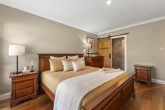 45 Forest Park Road West Blackheath NSW 2785 $1,450,000 - $1,550,000 Tucked away in one of Blackheath's peaceful and prestigious pockets, this masterfully renovated residence delivers a seamless blend of high-end craftsmanship, modern sustainability, and timeless design. Every inch of the home has been thoughtfully curated, from the hand-selected natural materials to the refined palette that harmonises with its alfresco sandstone surroundings. Expansive interiors showcase exquisite Spotted Gum timber flooring and custom Corian washplanes, while Duravit fixtures and a StoneKAST bath elevate bathrooms to a spa-like retreat. The kitchen and living zones flow effortlessly to serene outdoor spaces, framed by beautiful structurally landscaped gardens. With full insulation, premium double glazing, ducted climate control, and a powerful 13 kW solar array, this is a home that balances sophisticated comfort with cutting-edge efficiency. Designed for those who appreciate the quiet art of quality, this is Blackheath living at its most refined. Occupying a private cul-de-sac position surrounded by other salubrious properties, this generous level 1427 sqm block, is definitely one to add to your priority viewing list. Summary of Features: Open plan kitchen/living/dining with seamless connection to covered outdoor ent. High end kitchen with Calcutta Primo Quartz/u003e Quantum Quartz bench tops Walk-in butler's pantry with excellent additional storage; island bench seating Separate media room with bespoke floating cabinetry; bespoke linen/BIWs Designer Spotted Gum timber flooring by Stockmans Ridge Premium ROAK American Oak barn doors and Complete Doors Sydney Shaker doors Master with impressive built-in robes plus walk-in wardrobe; luxury shower ensuite Luxurious bathrooms with Duravit, StoneKAST and Corian fittings Atlas Concorde and Nanda designer tile selections throughout Hydrotherm heated towel rails and IXL Luminate Dual lighting/heating Elegant OLI Tap Vilo tapware and City Plus shower systems 13 kW solar system with 26 Trina Solar 500W panels and Growatt 10000TL-X inverter Fully insulated ceiling and external shell for year-round comfort Ducted electric heating and cooling system; gas hot water Safety glass windows throughout; stylish plantation shutters Double garage with internal access; Alarm system and security cameras installed Expansive level fully fenced landscaped gardens; three outdoor taps and hoses 1427sqm (approx) level block; private enclave 5 mins drive from village amenities