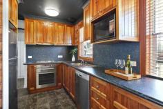6 Erang Place Koonawarra NSW 2530 $750,000 - $800,000 Tucked away at the end of a cul de sac, this home sits proudly on its level 627m² block, watching over the peaceful reserve that stretches out behind it. With no rear neighbours, mornings here begin with the sound of birds and not traffic. The home with its solar panels has been freshly painted throughout. Wide doorways flow from space to space, a design that welcomes everyone, young, old or mobility-assisted with ease and comfort. The timber kitchen is the kind of place where school lunches are prepared, stories are swapped over coffee and weekend dinners are shared. With its dishwasher and generous layout, it's ready for everyday living and easy entertaining. The new bathroom adds a touch of modern comfort, fresh, clean and beautifully finished. Every update throughout the home has been made to enhance simplicity, functionality and peace of mind. Outside, the backyard offers a sense of freedom. The wide side access makes it effortless to bring in a boat, trailer or even dream bigger, a workshop or granny flat (STCA). Families will love the space; investors will love the possibilities. Just a short stroll away the rhythm of the community comes alive. Kids ride their bikes to local schools; afternoons are spent at the soccer fields or basketball courts; weekends invite you down to the lake where the water glistens and the world feels a little slower. This isn't just a house. It's a place where life feels easy, where privacy and convenience meet and where every day brings a moment of calm. A home where you can live simply, comfortably and connected to the lifestyle you love.