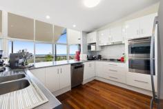 10-12 Horseshoe Bend Buderim QLD 4556 Perched high in a peaceful, elevated position, this unique split-level home captures breathtaking views that stretch across Alexandra Headland, Mooloolaba, Coolum and beyond. Thoughtfully designed to make the most of its stunning outlook, this home offers views from almost every window, bathing the interiors in natural light and sea breezes. This property offers an outstanding opportunity for redevelopment, with generous interiors, multiple living zones, and an impressive coastal outlook providing an ideal foundation for transformation. The segregated east wing-with its private living area and office-opens possibilities for dual living or layout redesign, while the central kitchen and balcony capture sweeping views perfect for future enhancement. Outside, the pool, lush gardens, and expansive decking create a versatile space ready for reinvention. Whether renovating, extending, or rebuilding, this spacious, well-positioned home presents a rare chance to craft something truly exceptional. At the heart of the home lies a large kitchen with generous storage, a 5-burner gas cooktop, and a stunning outlook to the coast - the perfect space to cook and connect while enjoying the views. Flowing seamlessly from the main living areas, an expansive balcony provides the ultimate spot for entertaining or simply unwinding while soaking in the panoramic coastal vistas. To the rear of the property, discover your own private oasis - a sparkling pool surrounded by lush greenery, outdoor decking, and expansive gardens, ideal for the creative mind or plant lover. The home also offers a separate suite downstairs with its own bathroom and toilet - perfect for guests, extended family, or a potential dual-living setup. Additional features include a large laundry with ample storage and external access, a wine cellar, double car garage with overhead storage, and extensive under-house storage. Set well back from the road and boundary lines, this residence offers the perfect blend