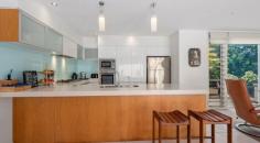 11 Eighteenth Avenue Sawtell NSW 2452 $3,000,000 Positioned less than 100 metres from the shoreline of stunning Murray's Beach in Sawtell , this meticulously designed residence combines architectural sophistication with exceptional liveability. Crafted by renowned architect Rosalie Stollery and constructed by Tisdell Homes in 2005, the home blends coastal charm with considered energy-efficient principles. With Feng Shui elements integrated into the design, the space has been curated to calm the mind and invigorate the spirit - creating a peaceful haven by the sea. North-facing and protected from the harsh eastern, western, and southern exposures, the home offers natural warmth in winter and cooling breezes in summer. Premium materials and smart design features further enhance year-round comfort, including energy-smart wall cladding with 3.0R thermal resistance, a concrete slab foundation that functions as a heat sink, and eco glass that moderates temperature and sound transmission. Louvre windows throughout allow for maximum airflow, capturing sea breezes with ease, while stainless steel security mesh adds peace of mind. Inside, the home offers four generous bedrooms and three bathrooms, perfectly suited for families or those who love to entertain. The oversized main bedroom is a true retreat, complete with a walk-in robe, spacious ensuite, and bifold doors that open onto a full-length balcony overlooking the garden. Two of the upstairs bedrooms also enjoy access to the outdoor living area and are large enough to comfortably accommodate king-sized beds. The thoughtful floorplan includes both walk-in and built-in robes, plus extensive built-in storage throughout the home. At the heart of the home is a spacious, light-filled living zone that includes a separate sunroom overlooking the pool and spa. Designed for indoor-outdoor living, large sliding doors connect the interiors with the landscaped gardens and paved entertaining areas, allowing you to make the most of Sawtell's idyllic climate. Downstairs features large tiled flooring, while upstairs is finished with a combination of plush carpet and beautifully polished Blackbutt timber. The home is serviced by a Daikin cassette air conditioning unit (replaced in 2022), and all upstairs bedrooms include ceiling fans for added summer comfort. Sustainability and efficiency are standout features, with a 6.2kW solar system, Tesla 13.5kW Powerwall battery, and Green Catch solar hot water system - all installed and commissioned in July 2025. Outdoors, the 13-metre lap pool and spa have been recently upgraded (re- fibreglassed and colour flow coated in 2022), and include a gas heating system, in-floor cleaning, and smart automation via the Astral Connect 10 Wi-Fi-enabled system. New aluminium stairs provide easy access to the upper-level outdoor living area, with timber stairs replaced as part of the home's regular maintenance program. The gardens are low maintenance and ideal for lock-and-leave living, making this home equally suited as a full-time residence or luxurious holiday base. Security is well-covered, with four motion-detecting cameras monitoring all access points. Remote access is available via an app, giving you full control whether you're at home or away. Perfectly positioned at the quiet end of the street, this home enjoys a peaceful setting with no road, train or pedestrian noise - all while being within walking distance to Sawtell Village (1km), Toormina Shopping Centre, and just minutes to the airport (6km) and hospital (5km). This is a rare opportunity to secure a premium coastal home in one of Sawtell's most tightly held beachside pockets. A lifestyle of quality, comfort and connection to the coast awaits.
