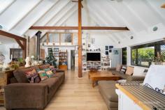 51 Park Street Uralla NSW 2358 $800,000 - $880,000 Set in a peaceful, elevated position and surrounded by established gardens, this beautifully presented family home offers space, flexibility and relaxed country living just moments from the heart of Uralla. Architecturally distinctive and rich in character, the home showcases a striking blend of elevated ceilings, exposed timber beams and thoughtfully layered textures that create warmth and individuality throughout. The vaulted living spaces, timber accents and natural light give the home a refined yet relaxed feel, while the wrap-around deck reinforces a strong connection between indoors and out. This is a property that feels carefully crafted rather than standard — offering a sense of charm, scale and personality rarely found in modern builds. The main living level is centred around a generous open-plan lounge and dining area. The kitchen is both functional and stylish, featuring quality appliances, ample bench space and excellent storage, and connects seamlessly to the living zones—ideal for everyday living and entertaining alike. From here, the home opens onto a wrap-around timber deck, offering multiple outdoor spaces to enjoy throughout the day. Whether it’s a morning coffee, long lunches or evening gatherings, the deck provides leafy outlooks and easy flow between indoor and outdoor living. A built-in spa enhances this outdoor setting, creating a private retreat to relax and unwind year-round. The main level includes three well-proportioned bedrooms. Bedroom two enjoys a walk-in robe, while bedrooms three and four both feature built-in wardrobes, with bedroom four also offering a convenient study nook—perfect for working from home or study. The main bathroom is thoughtfully designed with a separate shower and bath, complemented by a separate vanity room and separate toilet, providing excellent functionality for families. The upper level is dedicated to the private master retreat. This spacious bedroom features a walk-in robe, ensuite bathroom and its own peaceful outlook, creating a true parents’ sanctuary away from the main living areas. Downstairs, the home offers excellent vehicle and storage options with a large lock-up garage/workshop space accommodating two vehicles, along with additional room for tools, hobbies or storage. A separate carport sits adjacent to the garage, providing further covered parking. For added peace of mind, the home is also fitted with a security camera system. Set on a generous block with established landscaping and garden paths, the property combines privacy, practicality and charm, all within easy reach of Uralla’s schools, shops and cafés.