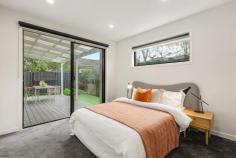 5/39 Simpsons Road Box Hill VIC 3128 Perfectly positioned within easy reach of Box Hill High School and Kerrimuir Primary, this contemporary two-storey townhouse delivers the ideal combination of modern style, everyday comfort and unrivalled convenience. Step inside to discover a light-filled open-plan living and dining zone designed for effortless entertaining and relaxed family living. Flowing seamlessly to a private courtyard, this inviting space is perfect for weekend gatherings or quiet moments outdoors. The sleek, designer kitchen takes centre stage, featuring stone benchtops, quality stainless-steel appliances and abundant storage. Upstairs, the spacious master suite complete with ensuite provides a peaceful retreat, while two additional bedrooms with built-in robes are serviced by a stylish central bathroom. For ultimate flexibility, a second master bedroom with ensuite is conveniently located on the ground floor-ideal for guests or multi-generational living. Further features include beautiful timber flooring, split-system heating and cooling throughout, a practical laundry, and a secure double garage with internal access for everyday ease. Located just minutes from Box Hill Central's bustling shopping, dining and transport hub, and surrounded by sought-after schools, parks and amenities, this exceptional residence offers an unbeatable lifestyle opportunity in one of Melbourne's most desirable pockets. Whether you're upsizing, downsizing or investing, this standout townhouse promises modern living at its very best.