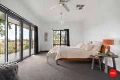 219 Fiddlers Green Road Kyneton VIC 3444 $1,575,000 - $1,675,000 • Spacious 5-bedroom + study family home on approx. 3.8 acres, offering a flexible floorplan ideal for multigenerational living, working from home and relaxed country living • North-facing open-plan kitchen, dining and living flowing to an elevated patio with sweeping views across the Campaspe River and surrounding countryside • Thoughtfully zoned, featuring a private master suite and a separate wing of four robed bedrooms with family bathroom and generous storage • Well-equipped for permanent country living, with quality fencing and paddocks, river frontage, established gardens, sheds, solar power, bore water and rainwater storage