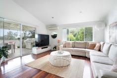 93A The Crescent Helensburgh NSW 2508 Set in a peaceful pocket of Helensburgh, 93a The Crescent presents a wonderful opportunity to secure a spacious home on a generous parcel of land, surrounded by privacy and a beautiful bush outlook. Set across 2 well designed levels, the home has been thoughtfully planned to offer both comfort and flexibility. The main living areas feature timber floors that create warmth and flow, while the bedrooms are finished with carpet for added comfort. All bedrooms include walk in robes, with the main bedroom enjoying its own ensuite complete with a large corner bath, creating a true parents retreat. Multiple living areas provide excellent separation for everyday living. Upstairs offers relaxed family living that opens seamlessly to a large undercover entertaining deck, perfect for hosting or unwinding while overlooking the fenced grassed yard. The bush outlook enhances the sense of calm and connection to nature, making the home feel like a private retreat. Downstairs, a large separate living or rumpus room adds exceptional versatility. This space could easily be used as a fourth bedroom, teenagers retreat, in law accommodation or home office, and is supported by a separate toilet for added convenience. Parking for 2 cars ensures practicality, while the generous land size provides breathing room that is increasingly hard to find. With its flexible layout, peaceful setting and strong connection to the outdoors, this is a home that adapts beautifully to different stages of life. A standout opportunity for buyers seeking space, privacy and a relaxed lifestyle in one of Helensburgh's most tightly held streets. Property Highlights Set across 2 spacious levels Beautiful bush outlook with excellent privacy Timber floors to main living areas 3 large bedrooms, all with walk in robes, main with ensuite and large corner bath Multiple living areas offering excellent separation Large separate downstairs living or rumpus room with potential for 4th bedroom Large undercover entertaining deck Location is key here, with the property a short drive to the Helensburgh Train Station, making it perfect for commuters looking for an easy 50-minute journey into Sydney. Location Highlights Picturesque Stanwell Park Beach is less than 10 minutes drive. The Royal National Park is within a 10 minute drive with easy access to numerous hiking trails and swimming spots. Short drive to Helensburgh CBD with supermarket, numerous cafes and restaurants and specialty store. Easy walk to Helensburgh train station with a convenient 50 minute commute to the city This is one of the only remaining areas where you can find a peaceful regional lifestyle less than an hour from Sydney. It offers all of those charming lifestyle benefits that one would associate with small town living:- bushwalking, swimming holes, bike tracks, sporting clubs, cafes and of course plenty of friendly people.