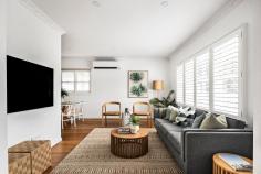 39 Murawa Street Frankston VIC 3199 $1,100,000 - $1,200,000 Exhibiting an impressive renovation and a meticulous attention to detail, this stylish weatherboard home offers a striking blend of simple beauty and sophistication. Occupying a 585sqm (approx.) beachside position complete with ample off-street parking and private alfresco entertaining, the FHSZ home delivers flawless versatility for couples or young families. A palpable dedication to craftsmanship resonates inside, where solid Tasmanian oak floors anchor an almost entirely refreshed interior, artfully incorporating gentle reminders of its heritage detailing. Open living and dining areas seamlessly blend with a Caesarstone-finished kitchen, featuring top-of-the-line Fisher & Paykel cooking appliances, elegant 2Pac painted shaker-style cabinetry, a dishwasher, Franke sink, and sophisticated brushed brass hardware. Two elegant bathrooms, including an ensuite, maintain a cohesive aesthetic throughout all wet areas. The family bathroom stands out with its feature tub and an oversized shower with dual heads and wall niche, while three good-sized bedrooms sit within easy reach. A covered Merbau deck at the rear offers a view of the yard, which includes a garden shed, double garage, and a drive-through tandem carport. Additional highlights include a 9kW split-system heating and cooling unit, and a position steps from the Foot Street shops, and blocks from University Hospital, George Pentland Botanic Gardens, Bayside Shopping Centre, and Frankston Foreshore.
