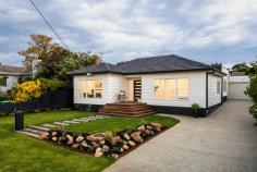 22 Hoadley Avenue Frankston South VIC 3199 $1,785,000 - $1,950,000 Set against a backdrop of landscaped gardens, where the calm of beachside living intertwines with the joy of family connection, this exquisitely transformed weatherboard home calls out to dreamers in search of a life filled with effortless beauty and elegance. With a reconfigured interior that exemplifies top-tier craftsmanship, the four-bedroom design seamlessly transitions from cosy accommodation to wow-factor entertaining space, set beneath strikingly high ceilings. Enhanced by elevated window heights and a fireplace that stretches its brick surround to the ceiling, the open-plan living and dining area is anchored by a premium kitchen equipped with butler's pantry, premium appliances, a stone waterfall island bench, and brushed gold tapware. Landscaped gardens present perfect for children, with open grassy play space supporting further entertaining with an outdoor kitchen, fire pit area, and direct roller door access from the double tandem garage. A front secondary lounge with views adds a separate space for adults, while the four-bedroom 2-bathroom accommodation is highlighted by the master suite with comprehensive walk-in robe, and luxurious dual-vanity ensuite with oversized shower with wall niche. Complete with split-system heating and cooling throughout, and a Frankston High School zoned address, it sits within a short distance of Frankston Beach, University Hospital, Frankston Train Station, and Bayside Shopping Centre.