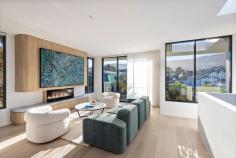 23 McCauley Street Thirroul NSW 2515 $4,850,000 Just steps from the shoreline, this architecturally designed residence pairs striking contemporary form with the relaxed warmth of a true coastal retreat. Every element has been carefully crafted - from polished, heated concrete floors and soaring 2.7M ceilings to expansive glass that draws in natural light and gentle sea breezes - creating a home that effortlessly balances sophistication and comfort. From the moment you step inside, the sense of quality, flow, and thoughtful design is undeniable. Whether it's morning coffee on the sun-washed deck, family gatherings in the open-plan living areas, soaking in the plunge pool on a warm summer day, or quiet moments in the master suite gazing out to the tree-lined escarpment backdrop, this home invites you to slow down and embrace coastal living. Blending bold architectural detail with soft, liveable textures, the property offers a serene lifestyle just a short stroll from the sand and surf of Thirroul Beach. YOUR HOME • This executive home is appointed to the highest standard, perfectly complementing its enviable location near some of the Illawarra's most pristine beaches and vibrant cafés. From the moment you step inside, the sense of quality, flow, and thoughtful design is undeniable. • Striking architectural design with clean lines, high ceilings, and abundant natural light enhancing the dramatic yet welcoming aesthetic. • Custom 4 person lift from ground to top floor- imported Italian made brand VEGA with extended warranty, suitable for wheelchairs. • Polished, heated concrete floors, bespoke feature lighting and knotwood timber accents deliver a modern coastal palette with a refined industrial edge. • Gourmet integrated kitchen featuring stone benchtops, sleek timber cabinetry, and top-of-the-line Bosch accent line appliances - ideal for both entertaining and everyday living. • Open-plan living and dining seamlessly extend to the expansive deck, creating an effortless indoor-outdoor lifestyle. • Luxurious master suite with spacious private ensuite, extensive 4 metre walk-in-robe w laundry chute, balcony and floor-to-ceiling glass capturing views over Thirroul village to the distant escarpment. • The low maintenance yard boasts a heated pool, perfect for relaxing during summer, an outdoor shower, great for washing off the sand after a trip to the beach, and plenty of tropical plants to accent the resort-like feel of the home. • Three additional bedrooms, each with a walk-in robe and personal ensuite, ensures that there is space and flexibility for the whole family. • Each room of the property includes independent air conditioning & heating, providing a level of comfort well-beyond your standard family home. • With direct access to the backyard, the second living area adds versatility to the home, whether utilised as a rumpus, home theatre, gym, office or 4th bedroom. YOUR LOCATION • This property is perfectly positioned, on a quiet and tranquil street only seconds from the heart of Thirroul. Everything that makes this beautiful beachside town so popular is only steps from your front door, including pristine beaches, charming cafes, quality restaurants, lively pubs, boutique shops, welcoming schools and convenient public transport. Escape the hustle and bustle while still enjoying all the conveniences of modern day living. • An ideal position for commuters with the local train station only minutes short walk, providing express trains to Sydney and Wollongong. • Thirroul is a popular seaside village with all of the amenities you need for your dream coastal lifestyle. It is positioned only 16 minutes to Wollongong and 73 minutes to Sydney. • Embrace coastal living with swimming, fishing, bushwalking and picnics in popular parklands all available only moments from your doorstep. Designed for those who value architecture, lifestyle, and location in equal measure, 23 McCauley St, Thirroul is more than a home - it is a statement. A rare opportunity to secure a contemporary coastal masterpiece in one of the Illawarra's most coveted beachside enclaves.