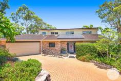 4 Scott Circuit Salamander Bay NSW 2317 Tucked away in one of Salamander Bay's most desirable streets, this solid brick home is full of warmth, charm, and functionality - perfect for families seeking coastal convenience. As you enter, you're welcomed by a staircase that leads to the sun-drenched living area. This inviting space features an abundance of windows that flood the room with natural light and offer leafy glimpses of the water. A sliding glass door opens out to the balcony, where you can enjoy calming filtered water views through the treetops. Flowing off the lounge is the open-plan kitchen and dining area. The kitchen is both stylish and practical, featuring a mix of striking blue feature tiles, sleek white cabinetry, and modern benchtops. It comes fully equipped with an electric cooktop, oven, and dishwasher. One of the standout features is the large window above the sink that frames a picturesque bush outlook and connects beautifully to the balcony setting. Featuring: - Four bedrooms of accomodation with built in wardrobes and ceiling fans - Laundry is equipped with an extra shower and separate toilet - Split system air conditioning and ceiling fans - Solar panels - Open plan living and dining area - Expansive balcony area with views - Large storage space underneath the property which may be utilised as a gym area or workshop Location: - 160m walk to Wanda Beach shopping village - 550m walk to Wanda Beach - 5 minute drive to Salamander Bay shopping centre - 1.7km walk to Bannisters Resort and Cheeky Dog This light-filled home combines peaceful living with everyday convenience - a must-see opportunity in a tightly held coastal pocket.