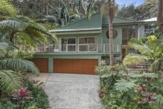 27 The Drive Stanwell Park NSW 2508 Set within your own private rainforest haven, this home offers a rare sense of calm with the soothing sound of nearby running water. Architecturally designed with high ceilings, expansive glazing and an open plan layout, the home feels bright, open and welcoming year round. Embrace the coastal lifestyle you and your family have been searching for, surrounded by native greenery and only a short walk from the sands of Stanwell Park Beach. YOUR HOME • Beautifully maintained, this residence works effortlessly as a peaceful family escape while also being perfectly suited to entertaining. A spacious alfresco deck, room for an outdoor fire pit and a seamless indoor outdoor flow create an inviting space for relaxed gatherings with family and friends. • A true sense of tranquility is felt throughout, with the home positioned on an approx 871m2 block surrounded by established trees and thoughtfully landscaped gardens. • The home offers two separate living zones, a contemporary kitchen, hardwood flooring and natural timber finishes, combining comfort with refined style. • Accommodation includes four bedrooms, each with built in wardrobes, along with a separate private studio featuring its own bathroom, laundry and kitchenette, with both internal and external access. This versatile space is ideal for extended family, teenagers or the option of supplementary income. • The master bedroom is a standout retreat, enjoying a peaceful leafy outlook that brings a holiday feel to everyday living. It also includes a generous walk in wardrobe and a well appointed ensuite. • Approximately a 200 metre near level walk to the pristine Stanwell Park Beach and directly opposite the beach reserve,and tennis courts, making coastal living and family beach days incredibly convenient. • Triple lock up garage with internal access. LIFESTYLE LOCATION • Just over 1 hour to Sydney CBD via car or train • A short walk to Stanwell Park Beach, ocean pool, parks, local school and vibrant community hubs • Surrounded by nature with escarpment views, coastal breezes, and plenty of recreational options including bushwalking and hang-gliding • Embrace the laid-back village feel while enjoying convenience and connectivity This home offers a rare opportunity to secure a contemporary coastal escape in one of the Illawarra's most sought-after seaside villages. Don't miss your chance to experience Stanwell Park living at its best.