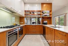4 South Terrace Kensington Gardens SA 5068 $4,400,000 - $4,600,000 Built c.1930 and cherished by the same family for over 32 years, this landmark residence unfolds across a magnificent 1,677sqm parcel in one of Adelaide’s most tightly held enclaves. Blending timeless character with modern comfort, it offers exceptional scale, multiple living zones and a resort-style rear garden with swimming pool and guest retreat. Opposite the green expanse of Kensington Gardens Reserve, this is an extremely rare opportunity to secure an elegant family estate in a truly coveted setting. Set beyond a broad, tree-lined frontage, the home makes an immediate impression with its grand, traditional verandah perfect for your morning coffee whilst enjoying the leafy outlook across the park. Inside, a wide entrance hall establishes the home’s grandeur, leading directly to the front living spaces. Timber floors, soaring 3m ceilings and original fireplaces speak to the residence’s character, while a thoughtful floorplan ensures effortless flow between formal and informal zones. Grand in scale yet warm in ambience, the formal dining and living rooms are framed by park-facing sash windows and graced with two working fireplaces, including a charming Inglenook. The atmosphere is one of quiet elegance, ideal for refined entertaining or simply retreating with family at day’s end. At the heart of the home, the open-plan kitchen, dining and living domain celebrates light, volume and connection. Exposed timber beams, a feature fireplace and a skylight create a space both welcoming and striking. The gourmet kitchen, appointed with dual AEG ovens, gas cooktop, Miele dishwasher and a large walk-in pantry, is designed for both everyday ease and entertaining. Sliding glass doors allow for seamless integration with the outdoor terrace, pool and landscaped gardens. The master suite is a serene retreat, complete with walk-in robe, additional built-in robes, ensuite with double vanity, bath, shower and luxurious underfloor heating. Dual access to the hallway enhances practicality, all whilst being framed by leafy park vistas. Four further bedrooms, each with built-in robes and one with a built-in desk, provide generous family accommodation. Fully renovated family bathrooms, complete with heated towel rails, enhance everyday comfort. Manicured lawns and established gardens frame a lifestyle of outdoor enjoyment. The 12.5m solar-heated saltwater pool takes centre stage, complemented by a pool/guest house with a kitchenette and French doors opening to a private courtyard, a great space for casual entertaining. The expansive rear lawn offers impressive scope for a tennis court (STCC), while also providing a setting designed for both relaxation and entertaining. Positioned on a prestigious tree-lined street, the home enjoys a commanding presence directly opposite Kensington Gardens Reserve, where tennis courts, cricket nets, playgrounds and BBQ facilities enrich family life. Enjoy the convenience of walking to Erindale Shopping Centre, with Burnside Village, The Parade Norwood dining precinct, and the CBD all just minutes away. AN EXTENSIVE LIST OF FEATURES INCLUDE: PARKING Double carport Multiple off-street options KITCHEN Dual AEG ovens Gas cooktop Miele dishwasher Walk-in pantry Skylight Abundant storage ELEVATIONS Polished timber floorboards Multiple fireplaces incl. Jetmaster Exposed timber beams High ceilings (3m+) Curtains + roller blinds Character sash windows COMFORT Ducted reverse-cycle air conditioning (zoned) Gas hot water system Heated towel rails & underfloor heating (master) SECURITY Monitored alarm system Intercom system throughout TECHNOLOGY NBN connection POOL 12.5m in length, 1m-1.8m-1.5m in depth Solar-heated, salt chlorinated Fully fenced Concealed pool pump Pool cover GUEST/POOL HOUSE Kitchenette & French doors Instant electric hot water Courtyard entertaining GARDEN Professionally landscaped with irrigation Expansive lawns, fruit trees & vegetable plot Potential to install full-size tennis court (STNCC) Powered tool shed STORAGE Built-in cabinetry WIR in master, BIR in bedrooms 2-4 Independent laundry (recently upgraded) Linen closet Under-stair wine storage POSITION Premium tree-lined street Opposite Kensington Park Reserve Minutes to Burnside Village & The Parade Walk to Erindale Shopping Centre SCHOOLS Zoned to Burnside PS, Magill PS & Norwood International HS Close to Pembroke & St Peters Girls Nearby Loreto, Rostrevor & Marryatville