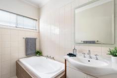 59A Orwil Street Frankston VIC 3199 $550,000 - $605,000 Bathed in a secluded in a north-facing orientation, this charming single-level villa stands as an ideal entry point or a secure investment, strategically positioned amidst the plethora of Frankston amenities. As one of only two on the block, this peaceful three-bedroom retreat features an off-street position, perfectly suited for those seeking a low-maintenance lifestyle while maintaining an enviable sense of accessibility. A single-level configuration is drenched in natural light, opening to an inviting social hub framed by elevated ceilings and a series of sliding doors. Keeping life easy, an adjoining kitchen boasts stainless steel appliances, dishwasher, and a breakfast bar, perfect for everyday functionality and small-scale hosting. With a private outdoor patio, three robed-bedrooms, and a family bathroom with separate shower and tub, the home ticks all the boxes with split-system heating and cooling, a secure grassy play space, garden shed, and an oversized single carport. Positioned within walking distance to Frankston Train Station, Bayside Shopping Centre, Frankston Beach, and public transport.
