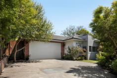 52B Dalpura Circuit Frankston VIC 3199 $780,000 - $858,000 Flooded with natural light, this beautiful townhouse is set privately on its own battle-axe block with no body corporate or common land. Positioned within the highly sought-after Whistlestop Estate, this rare single-story residence offers a low-maintenance lifestyle without compromising on luxury. The home makes a grand first impression with 2.7m ceilings and the timeless elegance of hardwood flooring flowing through the open-plan living and dining areas. The heart of the home is a stunning, versatile kitchen designed for the culinary enthusiast, featuring sleek Stone bench tops, a bright skylight, and an offset butler's pantry. This gourmet space is fully equipped with premium appliances, including a gas cooktop, an Asko Pro Series oven, and an Asko dishwasher. Accommodation is equally impressive, headlined by a large master bedroom with an ensuite, walk-in robe, and stunning garden views. Two additional spacious bedrooms, along with a fourth bedroom or study-which also enjoys picturesque garden outlooks-feature built-in robes and ceiling fans for year-round comfort. The contemporary family bathroom offers semi-ensuite access to the second bedroom, complemented by a convenient powder room, totaling three toilets, which are serviced by a dedicated water tank that also provides water for the garden. Modern comfort and security are at the forefront of this build. The home stays perfectly tempered via Braemar ducted heating, evaporative cooling, and a Mitsubishi split system, supported by Rinnai continuous flow gas hot water and custom-height double-glazed windows throughout. A Volta ducted vacuum system provides effortless cleaning. For ultimate peace of mind, the property is protected by a Bosch security alarm and a remote-control front gate leading to a double garage with internal access. Outside, the lush surroundings are effortlessly maintained by an automated sprinkler system. Located just minutes from local schools, shops, Peninsula Link, and Frankston's award-winning beaches, this is a unique opportunity to secure a premium home in a prime location.