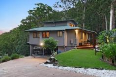 18 / 463 Trees Road Tallebudgera QLD 4228 $1,695,000 Co-existing in complete harmony with its natural wonderland setting, this residence is an stylish, serene and restful retreat. Set within the exclusive Glencairn Estate on a 2395m² block, where peace and privacy are paramount, it also basks in breathtaking vistas that sweep across the hinterland to the majestic Mt Tomewin ranges. Radiating calm and charm across two levels, blackbutt timber floors and high ceilings further amplify the sense of warmth and comfort. Chef's will be inspired to cook up a feast in a kitchen appointed with stainless steel benchtops and 900mm gas cooktop, with the option to enjoy it in the adjoining casual meals area or elegant dining zone. Then, for connection and conversation, retreat to the lounge room crowned by a soaring 4.9m ceiling, with an imported PyroClassic wood heater to curl up by in cooler months. New carpet flows underfoot in the bedrooms, led by a master suite with a built-in robe and contemporary ensuite. Two additional bedrooms with built-in robes are served by a modern bathroom, and one spills onto a balcony to soak in the fresh hinterland air. A bespoke circular staircase leads to a ground level study and versatile multipurpose room with ensuite – ideal for use as a teenage retreat, rumpus or guest quarters. Storage is abundant with under-house and internal storerooms, plus a laundry with an extra powder room ensures convenience. Outdoors, this tranquil haven continues to impress. The wraparound balcony is a sublime spot to savour the ever-changing colours of the valley and hinterland, while the front with built-in bar is a delightful spot to entertain. Lush greenery awaits at every glance too, while beyond your borders, protected council reserves add to its tranquillity and beauty. One of just 19 homes in a secure, gated enclave, you don't have to compromise on convenience. Tallebudgera State School and local shops are just 7 minutes away, St. Andrews Lutheran College is approx. 10 minutes by car, and vibrant Burleigh Heads beaches, boutiques, bars and more beckon in approx. 15 minutes. For those seeking a sanctuary with soul, serenity and seclusion – this is the one you've been waiting for. Inspect today! House Features: Effortlessly stylish, comfortable and charming haven co-existing in complete harmony with the natural habitat Basks in breathtaking vistas that sweep across to the majestic Mt Tomewin ranges Spans two levels, linked by a beautiful handcrafted circular staircase Chef's kitchen, equipped with a 900mm gas cooktop, stainless steel countertop for meal preparation, utensil racks, ample storage, breakfast bar and meals area Vast lounge crowned by a soaring 4.9m ceiling, offset by blackbutt timber floors and an imported PyroClassic Wood heater Dining area opens to balcony, with 3.2m ceiling Master suite with built-in robe and a contemporary ensuite with full-height tiling Two bedrooms with built-in robes; one with balcony access New carpet in all bedrooms Modern main bathroom Versatile multi-purpose room downstairs with ensuite; ideal as a teen retreat, rumpus, or bedroom Ground floor study opens to the outdoors Wraparound balcony basking in panoramic valley and hinterland views Front entertaining deck with built-in bar Laundry with additional powder room Under-house and internal storerooms Double carport Ceiling fans throughout Property Features: 2395m2 block in the gated Glencairn Estate – a secluded and exclusive enclave of just 19 homes Cocooned by council reserves and enriched by a Voluntary Conservation Agreement for Common Ground Driveway parking Lush, established greenery Veggie garden Wastewater system Inground water tank plus connected to town water Location: Approx. 7 mins to Tallebudgera State School and local shops Approx. 10 mins to St. Andrews Lutheran College Approx. 15 mins to Burleigh Heads Approx. 17 mins to Palm Beach Approx. 18 mins to Currumbin Alley Approx. 21 mins to Gold Coast Airport Approx. 36 mins to Surfers Paradise