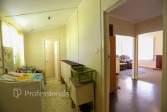 9 Calman Street Nulsen WA 6450 This 4-bedroom, 1-bathroom home is ready for someone with vision to bring it back to life. Featuring open plan living with reverse-cycle air conditioning, the layout provides a solid foundation for modern updates. Rear access leads to a generous backyard-perfect for shedding, extensions or creating a family-friendly outdoor space. With some maintenance and creativity, this property offers an excellent opportunity to add value and make it truly your own. Ideal for renovators, first home buyers or savvy investors. Within 400m to local shopping including supermarket, butcher and other specialty stores.