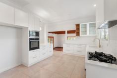 60 Halls Road Helensburgh NSW 2508 Set in a quiet, picturesque pocket with sweeping valley outlooks, this beautifully presented family home sits on an impressive 1,025m² parcel and delivers space, comfort, and lifestyle in equal measure. YOUR HOME • From the moment you enter, this inviting four-bedroom residence feels warm and welcoming, featuring soaring cathedral ceilings, polished hardwood flooring, and abundant natural light throughout. • The clever split-level layout offers multiple indoor and outdoor living zones, providing flexibility for families of all sizes, whether it is cozy evenings by the fireplace or hosting friends on the expansive covered deck. • At the heart of the home, the fully renovated kitchen has been thoughtfully designed for both style and function, complete with Caesarstone benchtops, heated floors, quality appliances, and gas cooking. • The generous main bedroom offers a peaceful retreat, boasting air conditioning, a walk-through wardrobe, and a private ensuite. • An entertainer's delight, the kitchen and dining zones connect effortlessly to the rear deck, capturing breathtaking valley sunsets and enhanced with electric blinds and a ceiling fan, making it the perfect setting for relaxed evenings or hosting friends year-round. • Just off the deck, a landscaped patio overlooks the backyard and provides the perfect spot to enjoy a morning coffee or unwind with a glass of wine. • Winter becomes something to look forward to, with a combustion fireplace creating a warm, inviting ambience throughout the home, perfectly complemented by reverse-cycle air conditioning for year-round comfort. • Those working remotely will appreciate the dedicated, fully fitted home office. • The home also includes a remote double garage with internal access, along with additional off-street parking. • Completing the package, the property benefits from rear lane access and a convenient rear pathway, offering future potential for landscaping, a swimming pool or additional parking, as well as an easy approximately 5-minute walk to Helensburgh train station for effortless commuting. LOCATION • Halls Road is a highly sought after pocket of Helensburgh. This family friendly street has bushwalking trails, the local dog park and train station all only steps from your front door. • Only minutes drive to shops, cafes, restaurants, transport, playgrounds and the free local swimming pool. • Picturesque Stanwell Park Beach is less than 10 minutes away. Enjoy Coastal living without the huge price tag. • This is one of the few remaining areas where a peaceful regional lifestyle meets city convenience, with Sydney's Central Station reachable in under an hour by train. Residents enjoy the charm of small-town living, with bushwalking, swimming holes, bike tracks, sporting clubs, cafés and a friendly community atmosphere. • With Helensburgh's growing popularity, now is the ideal time to secure a home in this family-friendly suburb, just 45 minutes south of Sydney and 30 minutes north of Wollongong.