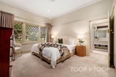 4 South Terrace Kensington Gardens SA 5068 $4,400,000 - $4,600,000 Built c.1930 and cherished by the same family for over 32 years, this landmark residence unfolds across a magnificent 1,677sqm parcel in one of Adelaide’s most tightly held enclaves. Blending timeless character with modern comfort, it offers exceptional scale, multiple living zones and a resort-style rear garden with swimming pool and guest retreat. Opposite the green expanse of Kensington Gardens Reserve, this is an extremely rare opportunity to secure an elegant family estate in a truly coveted setting. Set beyond a broad, tree-lined frontage, the home makes an immediate impression with its grand, traditional verandah perfect for your morning coffee whilst enjoying the leafy outlook across the park. Inside, a wide entrance hall establishes the home’s grandeur, leading directly to the front living spaces. Timber floors, soaring 3m ceilings and original fireplaces speak to the residence’s character, while a thoughtful floorplan ensures effortless flow between formal and informal zones. Grand in scale yet warm in ambience, the formal dining and living rooms are framed by park-facing sash windows and graced with two working fireplaces, including a charming Inglenook. The atmosphere is one of quiet elegance, ideal for refined entertaining or simply retreating with family at day’s end. At the heart of the home, the open-plan kitchen, dining and living domain celebrates light, volume and connection. Exposed timber beams, a feature fireplace and a skylight create a space both welcoming and striking. The gourmet kitchen, appointed with dual AEG ovens, gas cooktop, Miele dishwasher and a large walk-in pantry, is designed for both everyday ease and entertaining. Sliding glass doors allow for seamless integration with the outdoor terrace, pool and landscaped gardens. The master suite is a serene retreat, complete with walk-in robe, additional built-in robes, ensuite with double vanity, bath, shower and luxurious underfloor heating. Dual access to the hallway enhances practicality, all whilst being framed by leafy park vistas. Four further bedrooms, each with built-in robes and one with a built-in desk, provide generous family accommodation. Fully renovated family bathrooms, complete with heated towel rails, enhance everyday comfort. Manicured lawns and established gardens frame a lifestyle of outdoor enjoyment. The 12.5m solar-heated saltwater pool takes centre stage, complemented by a pool/guest house with a kitchenette and French doors opening to a private courtyard, a great space for casual entertaining. The expansive rear lawn offers impressive scope for a tennis court (STCC), while also providing a setting designed for both relaxation and entertaining. Positioned on a prestigious tree-lined street, the home enjoys a commanding presence directly opposite Kensington Gardens Reserve, where tennis courts, cricket nets, playgrounds and BBQ facilities enrich family life. Enjoy the convenience of walking to Erindale Shopping Centre, with Burnside Village, The Parade Norwood dining precinct, and the CBD all just minutes away. AN EXTENSIVE LIST OF FEATURES INCLUDE: PARKING Double carport Multiple off-street options KITCHEN Dual AEG ovens Gas cooktop Miele dishwasher Walk-in pantry Skylight Abundant storage ELEVATIONS Polished timber floorboards Multiple fireplaces incl. Jetmaster Exposed timber beams High ceilings (3m+) Curtains + roller blinds Character sash windows COMFORT Ducted reverse-cycle air conditioning (zoned) Gas hot water system Heated towel rails & underfloor heating (master) SECURITY Monitored alarm system Intercom system throughout TECHNOLOGY NBN connection POOL 12.5m in length, 1m-1.8m-1.5m in depth Solar-heated, salt chlorinated Fully fenced Concealed pool pump Pool cover GUEST/POOL HOUSE Kitchenette & French doors Instant electric hot water Courtyard entertaining GARDEN Professionally landscaped with irrigation Expansive lawns, fruit trees & vegetable plot Potential to install full-size tennis court (STNCC) Powered tool shed STORAGE Built-in cabinetry WIR in master, BIR in bedrooms 2-4 Independent laundry (recently upgraded) Linen closet Under-stair wine storage POSITION Premium tree-lined street Opposite Kensington Park Reserve Minutes to Burnside Village & The Parade Walk to Erindale Shopping Centre SCHOOLS Zoned to Burnside PS, Magill PS & Norwood International HS Close to Pembroke & St Peters Girls Nearby Loreto, Rostrevor & Marryatville