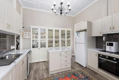 18 Grafton St Warwick QLD 4370 $689,000 Perfectly positioned in the heart of Warwick, this grand home oozes street appeal and is handy to schools, the CBD and many other facilities. This immaculate home is the perfect blend of timeless elegance along with modern day luxuries. I guarantee after inspecting this beautiful property, you will not want to leave! From the minute you enter the front gate, you are sure to be impressed! Here's what you will love about this home which has undergone major improvements in the last few years: * Freshly painted inside & out including the roof * Beautiful front verandah with north easterly aspect * Absolutely beautiful entry * VJ walls, leadlight features & high ceilings throughout * 2 x beautiful, sizable bedrooms plus a generous sleepout & study space * Spacious living areas with beautiful chandeliers to complement the space * R/C air-conditioners x 2 + insulated ceiling * Stunning NEW kitchen with electric appliances, dishwasher & walk in pantry * It offers ample bench & storage space along with a built in display cabinet * NEW custom made window coverings throughout - shutters & curtains * Tastefully renovated bathroom with refreshing pops of colour * Double carport with gable roof * Private & well fenced 911 sqm block with manicured gardens * NEW poly rainwater tank * 6.6 Kw solar (20 panels) - current owner has not paid a power bill in 4 years! * Security lights at the front and rear of home * An abundance of storage space underneath the house * A studio/workshop space downstairs as well Don't miss out on your chance to call this gem your own!