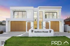 26A Kathleen Parade Picnic Point NSW 2213 Nestled in an exclusive, whisper-quiet cul-de-sac in the heart of Picnic Point, this brand-new five-bedroom duplex is a statement of refined modern living. Showcasing architectural curves, soaring ceilings and bespoke finishes, every detail has been carefully curated to deliver effortless luxury, space and sophistication. Property Flyover: - Brand new, architecturally designed 5-bedroom duplex in a tightly held Picnic Point cul-de-sac. - Expansive open-plan living enhanced by high ceilings, sculptural curves & designer lighting - Stunning designer kitchen with premium appliances, statement island & fully appointed butler's pantry - Custom bespoke joinery and high-end finishes throughout - Convenient downstairs bedroom with access to a full designer bathroom - ideal for guests or multigenerational living - Two lavish upstairs master suites with ensuites, including one with an oversized walk-in robe - Seamless indoor-outdoor alfresco entertaining with built-in BBQ. - Private, low-maintenance landscaped backyard. - Oversized garage with excellent storage capacity. - Access to a hidden, expansive parkland - perfect for children, entertaining or relaxed family gatherings. - Whisper-quiet cul-de-sac surrounded by prestige homes. - Moments to quality local shops, cafés and easy access to express train services. A rare opportunity to secure a truly sophisticated residence in one of Picnic Point's most desirable locations.