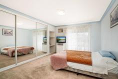 2 Castle Place Padstow Heights NSW 2211 Positioned in a quiet cul-de-sac within a peaceful, family-friendly pocket, this solid brick veneer residence offers flexibility, space and long-term potential in a highly central location. Just moments from Padstow and Revesby, close to Illawong and Alfords Point, and within easy reach of both Hurstville and Bankstown CBDs, the home delivers privacy without sacrificing convenience. Designed to accommodate large families or multi-generational living, the property can function as one expansive home or be configured as two separate two-bedroom accommodations. The main residence features a formal living area complete with a bar, flowing through to a separate formal dining room and an original kitchen presented in pristine condition for its age, complete with a walk-in pantry. From the kitchen, step out to a rear porch with stairs leading down to the backyard. This level also offers two bedrooms with built-in wardrobes, ducted air conditioning, a linen closet, and a spacious two-way bathroom with shower, separate bathtub, bidet and separate toilet. At the front of the home, an elevated balcony and porch provide a pleasant outlook over the street. The secondary accommodation provides excellent privacy and flexibility, ideal for in-law children or extended family. It includes its own kitchenette with ample storage, separate living and dining area, private access to the backyard, powder room and additional toilet. Upstairs, there are two generous bedrooms with built-in wardrobes and balcony access, a landing area, and a full bathroom with a shower and toilet. Please note the upstairs balcony requires attention and will not be accessible during open inspections. On the ground level, the home continues to impress with a double garage accessible from the driveway, which also allows off-street parking for two additional vehicles. There is extensive under-house storage, a separate workshop, a billiards or games room with sliding door access to the backyard, a bar area ideal for entertaining, and a separate laundry with external access and an additional toilet. Set on a generous parcel in a tightly held street, the property also presents future development potential subject to council approval. Whether you are searching for a spacious family home, a blank canvas ready to renovate and personalise, or a unique investment with genuine dual income potential, this is an opportunity not to be missed. 2 Castle Place offers flexibility, space and future upside in one of Padstow Heights' most desirable and convenient locations.