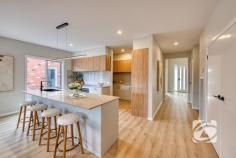 34 Brushtail Rd Nar Nar Goon VIC 3812 $900,000 - $990,000 Why endure the wait of building when you can step straight into a brand-new, fully turnkey residence today? Beautifully positioned within the prestigious Ridgelea Estate, this exceptional home delivers a refined blend of contemporary design, intelligent functionality and effortless, low-maintenance living—perfectly suited to families or discerning buyers seeking a seamless lifestyle upgrade. Thoughtfully designed for both comfort and sophistication, the home comprises four generous bedrooms, including an elegant master suite complete with a beautifully appointed ensuite and spacious walk-in robe. The remaining bedrooms are fitted with built-in robes and are serviced by a stylish central bathroom. At the heart of the residence, a designer kitchen makes a striking statement, showcasing premium appliances, an expansive island bench and a substantial walk-in pantry. This culinary hub overlooks the open-plan living and dining domain, creating a natural gathering space for everyday living and entertaining alike. A second living zone provides flexibility for growing families, offering the perfect setting for relaxation or a private retreat. Seamless indoor-outdoor integration is achieved with a covered alfresco area under the roofline, extending the living space and providing an inviting environment for year-round entertaining. Outdoors, the property is fully landscaped and complemented by quality window furnishings, ensuring a complete, move-in-ready experience. Comfort is assured throughout the seasons with zoned heating and cooling, while a double garage with internal access enhances everyday convenience. Designed with meticulous attention to detail and finished in a modern, sophisticated palette, this impressive residence presents an outstanding opportunity to secure a premium home in a highly regarded estate—ready to move in and enjoy from day one.