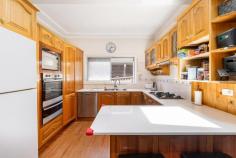 15 Edmund Street Beverly Hills NSW 2209 Positioned in a quiet cul-de-sac on the high side of the street, this stunning split-level full brick residence is perfectly suited to large families or astute investors. Enjoy a convenient lifestyle just a 12-minute walk to Beverly Hills Station, shops, and local amenities, or a 10-minute drive to Hurstville CBD. Beverly Hills Public Primary School is just around the corner. The upper level features a spacious open-plan lounge and dining area flowing seamlessly to a private, covered entertaining space and beautifully landscaped backyard - ideal for family living and entertaining. The stylish kitchen boasts solid timber cabinetry, stainless steel appliances, gas cooking, Caesarstone benchtops, and a dishwasher. Accommodation includes four generous bedrooms, three with built-in wardrobes. The master bedroom offers an elegant ensuite, while the second-largest bedroom includes a well-sized study area. Both front bedrooms open onto a large undercover balcony with attractive outlooks. The main bathroom is located at the rear of the home and features a separate bathtub, shower, toilet, and vanity. A full-sized internal laundry adds further convenience. Additional features include: ducted air conditioning polished timber floors throughout an electric security gate storage shed and much more. The lower level, of full brick construction, offers a massive family room and a large double lock-up garage with ample storage. There is also secure off-street parking for two additional vehicles behind the remote-controlled electric gate. Set on a level block measuring 11.7m wide by 45.1m deep (approximately 474.2sqm), the property is free of sewer pipes and easements. Currently owner-occupied, the home offers excellent investment potential with an estimated rental return of $1,300-$1,400 per week. There is also potential to add a two-bedroom granny flat (STCA), which could generate an additional $650 per week - delivering a combined rental income of approximately $2,000 per week.