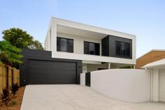 2/74 King Street Buderim QLD 4556 A striking statement in contemporary architecture, this brand-new two-storey duplex at 2/74 King Street showcases refined luxury, architectural detail and effortless indoor-outdoor living - all delivered with uncompromising quality. From its striking façade to its meticulously curated interiors, the home immediately conveys sophistication. Clean lines are softened by considered design elements, creating a residence that feels both architecturally impressive and warmly inviting. Upstairs is a private sanctuary dedicated to rest and retreat. The upper level comprises three generously proportioned bedrooms plus a dedicated media room, all thoughtfully positioned away from the entertaining zones below. The media room offers exceptional flexibility - ideal as a home theatre, second living area, children's retreat or easily converted fourth bedroom if desired. A sculptural curved feature wall adds a bespoke architectural statement, introducing softness and visual interest rarely found in duplex design. Upstairs is a private sanctuary dedicated to rest and retreat. The upper level compromises three generously proportioned bedrooms plus a dedicated media room, all thoughtfully positioned away from the entertaining zones below. The The master suite is a true haven of comfort and luxury. Generous in scale, it features a beautifully appointed ensuite and a spacious walk-in wardrobe, offering both functionality and refined elegance. The additional bedrooms are equally well-proportioned, ideal for family living, guests or a sophisticated home office. The main bathroom is designed with spa-like indulgence in mind, complete with a statement bath and premium fittings. Downstairs, the home unfolds into a light-filled open-plan living and dining domain designed for both grand entertaining and effortless daily living. The designer kitchen forms the centrepiece - showcasing premium appliances, custom cabinetry and expansive stone surfaces. A striking island bench top anchors the space, creating the perfect setting for entertaining, casual dining and connection. A fully appointed butler's pantry enhances both luxury and practicality, providing additional preparation space and discreet storage while seamlessly connecting through to the laundry. A separate downstairs powder room adds further convenience for guests. Expansive glazing invites natural light throughout and creates a seamless transition to the covered alfresco terrace - an elegant extension of the interior living space, ideal for year-round entertaining. The fully fenced grounds provide privacy, security and low-maintenance ease, completing a residence designed for modern luxury living. Features you'll love: Brand-new architecturally designed duplex Three generously proportioned bedrooms plus dedicated media room upstairs Luxurious master suite with ensuite and walk in wardrobe Main bathroom with large statement bath Designer kitchen with premium appliances and expansive island bench top Butler's pantry with direct access to the laundry Separate downstairs powder room Premium finishes and quality appliances Comfort has been prioritised with ducted air conditioning and ceiling fans throughout Expansive covered alfresco entertaining area Fully fenced, private yard Low maintenance landscaping This exceptional residence offers the rare combination of contemporary luxury, intelligent design and effortless lifestyle appeal. Move-in ready and finished to an impeccable standard, 2/74 King Street presents an outstanding opportunity to secure a refined, modern home in a highly desirable setting.