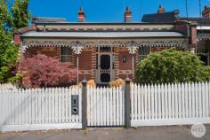 333 Lydiard Street North Soldiers Hill VIC 3350 $995,000 - $1,090,000 Gracefully positioned on an expansive block of tightly held Lydiard Street North, this magnificent brick Victorian delivers timeless elegance, grand proportions and refined modern updates all just a five-minute stroll from the station and CBD. Beyond the classic façade, including original kookaburra iron lacework, the home unfolds into four exceptionally spacious bedrooms, each featuring built-in robes and original iron fireplaces with timber mantles, adding warmth and character throughout. The master suite is a true retreat, complete with walk-in robe and a luxurious full ensuite. The heart of the home is the stunning renovated kitchen, beautifully appointed with quality stainless steel appliances including a dishwasher, and designed to effortlessly service both everyday living and entertaining. This flows seamlessly into an oversized family room and generous dining area, creating an inviting space for gatherings of any size. Polished timber floorboards feature throughout, complemented by gas ducted heating, FTP connectivity, a renovated family bathroom with bathtub, and a large, fully updated laundry. Ensuring comfort meets practicality at every turn. Outdoors, the recently landscaped, low-maintenance gardens are framed by established shady trees, creating a serene and private setting to relax, entertain or simply enjoy. A rare opportunity to secure an elegant Victorian residence of this calibre in one of Ballarat's most sought-after locations.