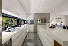10 Koetong Parade Mount Eliza VIC 3930 $2,250,000 - $2,450,000 Prominently positioned between Kunyung Primary School and Mount Eliza Village, and just a short walk from Ranelagh Beach, this glamorous family residence embodies the pinnacle of sophisticated living with a clever combination of space, function and understated elegance. Architecturally designed to accommodate the evolving needs of a modern household across two thoughtfully zoned levels, with clever planning emphasising privacy and natural light within its four-bedroom, three-bathroom configuration. Double height ceilings and a two-storey stacked stone electric fireplace serves as the focal point between lavish living, dining and kitchen spaces; the last of which features a comprehensive fit-out with top-tier appliances and walk-in pantry, all concealed beyond a luxury stone entertaining island and extensive cabinetry. A smooth flow from the indoors to the outdoors is facilitated by bi-fold glass doors, broadening the entertaining area to a large alfresco deck, complete with strip heating, and ceiling fan. Vast spaces continue to impress across the upper level, revealing a 6.9m walk-in robe and a luxurious ensuite with a single slipper tub, spoiling couples in the master suite. Featuring three secondary bedrooms, one with balcony access and another with an ensuite, the home boasts luxurious amenities, including a rumpus room with a custom bar, a first-floor kids' retreat, an open study, a low-maintenance backyard, an internally accessed triple garage with drive-through capabilities, and an enclosed double carport at the base of a return drive. Set within the Kunyung Primary School zone and just moments from Peninsula Grammar, public transport, and the many beaches that line Port Phillip Bay.