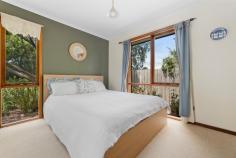 18 Balmerino Square Frankston VIC 3199 $980,000 - $1,060,000 Set in a serene, tree-lined court in Frankston, this expansive double-storey home is designed for growing families, multi-generational living, or anyone who craves space, character, and flexible entertaining. With three generously sized bedrooms, a dedicated home office or fifth bedroom, and multiple indoor and outdoor living zones, it seamlessly combines warmth, charm, and functionality across a sprawling layout. At the heart of the home, the kitchen offers a five-burner gas cooktop, wall-mounted oven, double sink, breakfast bar, and garden-view window, ideal for home cooks or entertainers. Adjacent to the kitchen, the dining room glows under a skylight and includes a feature bar, perfect for hosting family and friends. The large vaulted family room and separate lounge showcase beautiful wood detailing, slate tiling, and natural light streaming through oversized windows. The upstairs master suite is a true retreat with private balcony access, walk-in robe, air conditioning, and a spacious ensuite with double vanity and oversized shower. Downstairs, three additional bedrooms include built-in robes, mirrored storage, timber floors, and garden outlooks, while a stylish main bathroom features a freestanding tub, rainfall shower, and quality fixtures. The separate home office with built-in robe and window is ideal for remote workers or quiet study. Outside, the property unfolds into beautifully landscaped gardens with multiple alfresco options. Enjoy outdoor meals under the covered patio, relax in the central BBQ courtyard, or retreat to the private sauna for an end-of-day escape. A stone pathway winds through lush garden beds and mature greenery, adding a tranquil feel throughout. Practicality is covered with a full-size laundry, split system air conditioning, double carport, two sheds (including a cubby-style space), and a large rumpus/games room that connects to both the front and rear of the property. Situated within easy reach of local schools, parks, shopping precincts and transport, this unique property delivers a rare blend of charm, scale, and indoor-outdoor lifestyle in a tightly held Frankston pocket.