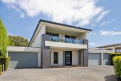 10 Koetong Parade Mount Eliza VIC 3930 $2,250,000 - $2,450,000 Prominently positioned between Kunyung Primary School and Mount Eliza Village, and just a short walk from Ranelagh Beach, this glamorous family residence embodies the pinnacle of sophisticated living with a clever combination of space, function and understated elegance. Architecturally designed to accommodate the evolving needs of a modern household across two thoughtfully zoned levels, with clever planning emphasising privacy and natural light within its four-bedroom, three-bathroom configuration. Double height ceilings and a two-storey stacked stone electric fireplace serves as the focal point between lavish living, dining and kitchen spaces; the last of which features a comprehensive fit-out with top-tier appliances and walk-in pantry, all concealed beyond a luxury stone entertaining island and extensive cabinetry. A smooth flow from the indoors to the outdoors is facilitated by bi-fold glass doors, broadening the entertaining area to a large alfresco deck, complete with strip heating, and ceiling fan. Vast spaces continue to impress across the upper level, revealing a 6.9m walk-in robe and a luxurious ensuite with a single slipper tub, spoiling couples in the master suite. Featuring three secondary bedrooms, one with balcony access and another with an ensuite, the home boasts luxurious amenities, including a rumpus room with a custom bar, a first-floor kids' retreat, an open study, a low-maintenance backyard, an internally accessed triple garage with drive-through capabilities, and an enclosed double carport at the base of a return drive. Set within the Kunyung Primary School zone and just moments from Peninsula Grammar, public transport, and the many beaches that line Port Phillip Bay.