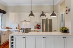 39 Second Street Blackheath NSW 2785 $1,400,000 - $1,500,000 Set high on a private corner block in a peaceful, tightly held street, this exceptional Melandra residence delivers refined Blue Mountains living at its absolute finest and is a turn key offering. Just eight years young and built to exacting standards, the home blends classic mountain character with contemporary luxury, creating an instantly welcoming and enduring appeal. High ceilings, polished Jarrah hardwood floors and a curated palette of quality finishes set a tone of understated sophistication throughout. Designed for effortless living and entertaining, the open plan kitchen and dining space flows seamlessly into a stunning living room anchored by a gas log fire, while large windows frame garden views and invite natural light. The gourmet kitchen opens directly to a north-easterly deck, perfect for relaxed alfresco dining or morning coffee. The generous master bedroom is a true retreat, complete with built-in robes and a peaceful sitting area overlooking the garden. Two additional bedrooms, including a versatile third bedroom or study with custom cabinetry, provide flexibility for family, guests or work-from-home living. The beautifully appointed bathroom and laundry showcase heritage-inspired tiles and finishes, while modern comforts including gas central heating, reverse cycle air conditioning and double glazing ensure year-round comfort. Outside, professionally landscaped gardens create a private, serene setting that perfectly complements the home's timeless elegance. Council approved plans for a carport ensure that any extra work required will be minimal effort. This home's proximity to beautiful surrounding bush walks is the icing on the cake. Conveniently located just 1.6km from the village, train station, shops and cafés, this is a truly special offering in a sought-after Upper Blue Mountains location. Breakdown of Features: Elevated, private corner block in a quiet street Eight-year-old Melandra home, built to exceptional standards High ceilings and polished Jarrah hardwood floors Open-plan kitchen, dining and living with gas log fire North-easterly deck with seamless indoor-outdoor flow Gourmet kitchen with quality finishes and generous storage Master bedroom with built-in robes and sitting area Second bedroom with built-in robes Third bedroom or study with custom cabinetry Heritage-inspired bathroom and laundry finishes Central heating, reverse-cycle air conditioning and double glazing Professionally landscaped, private gardens Council approved plans for carport Excellent proximity to beautiful bush walks 1.6km to village shops, cafés, services and train station