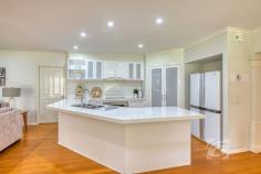 14 Valley Dr Beaconsfield Upper VIC 3808 $2,100,000 - $2,300,000 Park-Like Living, Perfected Set on a beautifully maintained acre of landscaped grounds, this substantial residence presents a rare opportunity to secure a foothold in one of the area’s most tightly held and sought-after enclaves. Privately positioned on the flat side of exclusive Valley Drive and backing directly onto a pristine nature reserve, the property offers an exceptional sense of space, tranquility and prestige. Framed by established trees and lush gardens, the grounds create a peaceful sanctuary that blends seamlessly with the adjoining reserve. Rich with birdlife and thoughtfully curated, the landscape provides a picturesque setting for both outdoor entertaining and quiet moments of relaxation. The 21-year-old Porter Davis home is generously proportioned and thoughtfully designed, offering a flexible floorplan suited to a variety of lifestyles. Multiple living zones, both formal and informal, are filled with natural light, with well-positioned windows drawing the surrounding greenery inside. At the heart of the home, a well-appointed stone kitchen connects effortlessly with the sunlit family and dining areas, creating a warm hub for everyday living. Accommodation includes four oversized bedrooms, highlighted by a spacious master suite with walk-in robe and private ensuite featuring a double vanity. A versatile retreat adjoining the master could easily function as an additional living area, home office or fifth bedroom depending on your needs. Additional features include plantation shutters, new carpet, ducted heating, evaporative cooling, split system air conditioning, solar panels, ducted vacuum and internal access to the remote double garage. French doors open to alfresco entertaining overlooking the beautifully established gardens, showcasing an impressive collection of around 70 species including Chestnut trees, Japanese Maples, Golden Ash, Silver Birches, Canadian Maples and Lemon trees. With mains water, shedding, a double carport in addition to the garage and a unique “wine gate” connecting to the neighboring property, this is a home designed for both lifestyle and connection. Homes of this calibre in such a prestigious and tightly held location are rarely offered, providing a lifestyle of space, privacy and natural beauty just moments from local schools, shopping and transport.