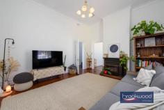 42 Broome Terrace Northam WA 6401 $749,000 Opposite the Avon River, behind a white picket fence and a garden planted with lavender and roses, sits a home that was built to last. The deep verandah, the jarrah floors, the 11-foot ceilings with their decorative cornicing – nothing here has been lost in the name of renovation. What you get instead is a generous, characterful early twentieth-century home on a 1692 sqm riverside block and a floorplan that has plenty of room to adapt to whatever you need it to be. 3 bedrooms 1 bathroom Rendered brick and iron Riverside overlooks Avon Striking 11-foot ceilings Glorious jarrah floorboards Flexi FP space hm business Manual retic front garden Drive-in fenced backyard 1692 sqm level fenced lot Walk the bridge to town Step through the gate and up the arching front steps to a deep, shaded verandah. Morning coffee here, watching the Avon meander past, sets the tone of life in a big country town. Inside, the integrity of the original build is immediately apparent. Jarrah floorboards in rich ox-blood tones run across much of the plan, 11-foot ceilings with decorative cornicing and ceiling roses amplify every room, and the formal lounge – anchored by a slow combustion fire set into the original hearth – balances period character with a modern neutral palette and split-system air conditioning. A pair of glass doors connects this room to the verandah, so the line between inside and out blurs easily. The eat-in kitchen is generously proportioned, with a freestanding oven set within the white-tiled original hearth, overhead and under-bench cabinetry along one wall, and ample room for a family table. At the end of the central hall, a carpeted multi-purpose room opens onto a sizeable rear verandah and alfresco – it could be a formal dining room, a playroom, or a media room; the brief is yours to write. The principal bedroom sits at the front of the plan – large, calm, fitted with built-in robes, plush carpet, and a ceiling fan, it looks out to the fountain and front garden. A second junior bedroom sits nearby. This junior room has glass doors leading to a sunken wing of two spacious rooms with a separate entry – currently used as a home office and gym. This is where the property’s flexibility really shines: a home-based business, a guest suite, a teenager’s retreat, or a combination of all three. The rear of the property is fully fenced, with drive-in access through gates at the back of the double carport. A Colorbond shed and lean-to occupy one corner, a Jacaranda tree shades the built-in barbecue, and the level yard is a blank canvas – vegetable garden, pool or landscaped entertaining space. This is part of Northam’s historic residential precinct – an area rich in late nineteenth- and early twentieth-century character. Iwan Iwanoff’s striking Public Library is nearby, as is the heritage-listed Northam Flour Mill and the Northam Railway Station. The Avon River suspension footbridge is a short stroll away and leads to Northam’s main street with its heritage shopfronts, cafes, and essential services. Perth CBD is a comfortable day-trip of just over an hour’s drive. Perth Airport sits approximately 90 km away. For those who commute occasionally rather than daily, the Avon Valley lifestyle makes the distance easy to absorb. Northam draws visitors from Perth for the Avon Descent, hot air ballooning over the valley, and the town’s own considerable heritage appeal. Living here is a different pace – not remote, not a compromise, but a considered choice.
