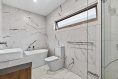 25 Pine Way Doncaster East VIC 3109 $1,500,000 - $1,650,000 Generous Multi-Level Family Living in the East Doncaster Secondary College Zone Beautifully designed and thoughtfully appointed, this spacious multi-level residence offers a superb blend of modern comfort, family practicality and flexible living spaces in a quiet Doncaster East pocket. The heart of the home is the expansive open-plan living and dining area, where timber flooring, high ceilings and abundant natural light create a warm and inviting atmosphere. A sleek contemporary kitchen with stone island bench, quality appliances and ample storage makes everyday living and entertaining effortless. Adding further versatility, a second kitchen/butler's kitchen provides the perfect setup for larger families or those who love to cook and entertain. Sliding doors connect the living area to a private deck and courtyard garden, creating a seamless indoor-outdoor flow ideal for relaxed gatherings and weekend entertaining. Accommodation is generous and thoughtfully arranged across multiple levels. Several bedrooms enjoy balcony access, while the well-appointed master suite features a walk-in robe and private ensuite, offering a comfortable retreat at the end of the day. A large lower-level family area provides exceptional flexibility - perfect as a home theatre, games room, teenage retreat, guest accommodation or home office space. Adding further appeal for families, the property sits within the highly sought-after East Doncaster Secondary College (EDSC) school zone, one of Melbourne's most respected public secondary schools, and is also within the catchment for Donburn Primary School. Additional features include: • Contemporary stone kitchen with island bench • Second kitchen / butler's kitchen • Multiple living zones across levels • Quality bathrooms with modern finishes • Heating and cooling for year-round comfort • Lock-up garage with internal access • Private deck and low-maintenance courtyard Positioned in a peaceful residential street, the home enjoys easy access to local parks, shopping, transport and excellent schools, delivering a lifestyle of convenience and long-term family appeal. A spacious modern residence in a prized school catchment - ready to move in and enjoy.
