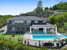 10 Mieke Court Burleigh Heads QLD 4220 $2,295,000 Positioned at the end of a quiet cul-de-sac, this large family home occupies an elevated 961m² block and offers space, privacy and a highly functional layout ideal for family living. With multiple living areas, generous proportions and excellent outdoor amenities, the home has been designed to comfortably accommodate growing or extended families. The residence comprises five well sized bedrooms, all with walk in robes. The master suite features a spacious ensuite with a custom barn style door, while the fifth bedroom on the lower level includes its own ensuite and is well suited to guests, teenagers or multi generational living. High ceilings and large windows enhance the sense of space and allow plenty of natural light throughout both levels. The home presents beautifully, with recent painting completed in the main living areas including the kitchen, living spaces and hallways, along with a modernised kitchen splashback. The kitchen is well appointed with a large island, stone benchtops, walk in pantry and stainless steel appliances, and connects seamlessly to the open plan living and dining area. Multiple living zones include an upstairs lounge, a downstairs media room and open plan family areas that extend to the covered alfresco entertaining space. Framed by lush landscaped gardens, the outdoor entertaining area overlooks the pool and decking, a generous grassed yard ideal for children, pets or a fire pit setting, and captures views out to the west with fantastic sunset views, creating a beautiful setting for relaxed evenings with family and friends. Additional features include zoned ducted air conditioning, 7.7kW solar panels and excellent vehicle accommodation. Along with the double garage, an additional driveway has been added to allow for boat and caravan parking. Located in a family friendly neighbourhood, parklands with a playground and basketball court are positioned at the end of the street. Old Burleigh Town is known for its quiet streets, walking tracks and proximity to local amenities, quality schools and direct access to the M1, providing seamless connectivity north and south. Burleigh Beach is also conveniently close by.