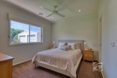 14 Valley Dr Beaconsfield Upper VIC 3808 $2,100,000 - $2,300,000 Park-Like Living, Perfected Set on a beautifully maintained acre of landscaped grounds, this substantial residence presents a rare opportunity to secure a foothold in one of the area’s most tightly held and sought-after enclaves. Privately positioned on the flat side of exclusive Valley Drive and backing directly onto a pristine nature reserve, the property offers an exceptional sense of space, tranquility and prestige. Framed by established trees and lush gardens, the grounds create a peaceful sanctuary that blends seamlessly with the adjoining reserve. Rich with birdlife and thoughtfully curated, the landscape provides a picturesque setting for both outdoor entertaining and quiet moments of relaxation. The 21-year-old Porter Davis home is generously proportioned and thoughtfully designed, offering a flexible floorplan suited to a variety of lifestyles. Multiple living zones, both formal and informal, are filled with natural light, with well-positioned windows drawing the surrounding greenery inside. At the heart of the home, a well-appointed stone kitchen connects effortlessly with the sunlit family and dining areas, creating a warm hub for everyday living. Accommodation includes four oversized bedrooms, highlighted by a spacious master suite with walk-in robe and private ensuite featuring a double vanity. A versatile retreat adjoining the master could easily function as an additional living area, home office or fifth bedroom depending on your needs. Additional features include plantation shutters, new carpet, ducted heating, evaporative cooling, split system air conditioning, solar panels, ducted vacuum and internal access to the remote double garage. French doors open to alfresco entertaining overlooking the beautifully established gardens, showcasing an impressive collection of around 70 species including Chestnut trees, Japanese Maples, Golden Ash, Silver Birches, Canadian Maples and Lemon trees. With mains water, shedding, a double carport in addition to the garage and a unique “wine gate” connecting to the neighboring property, this is a home designed for both lifestyle and connection. Homes of this calibre in such a prestigious and tightly held location are rarely offered, providing a lifestyle of space, privacy and natural beauty just moments from local schools, shopping and transport.