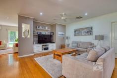 14 Valley Dr Beaconsfield Upper VIC 3808 $2,100,000 - $2,300,000 Park-Like Living, Perfected Set on a beautifully maintained acre of landscaped grounds, this substantial residence presents a rare opportunity to secure a foothold in one of the area’s most tightly held and sought-after enclaves. Privately positioned on the flat side of exclusive Valley Drive and backing directly onto a pristine nature reserve, the property offers an exceptional sense of space, tranquility and prestige. Framed by established trees and lush gardens, the grounds create a peaceful sanctuary that blends seamlessly with the adjoining reserve. Rich with birdlife and thoughtfully curated, the landscape provides a picturesque setting for both outdoor entertaining and quiet moments of relaxation. The 21-year-old Porter Davis home is generously proportioned and thoughtfully designed, offering a flexible floorplan suited to a variety of lifestyles. Multiple living zones, both formal and informal, are filled with natural light, with well-positioned windows drawing the surrounding greenery inside. At the heart of the home, a well-appointed stone kitchen connects effortlessly with the sunlit family and dining areas, creating a warm hub for everyday living. Accommodation includes four oversized bedrooms, highlighted by a spacious master suite with walk-in robe and private ensuite featuring a double vanity. A versatile retreat adjoining the master could easily function as an additional living area, home office or fifth bedroom depending on your needs. Additional features include plantation shutters, new carpet, ducted heating, evaporative cooling, split system air conditioning, solar panels, ducted vacuum and internal access to the remote double garage. French doors open to alfresco entertaining overlooking the beautifully established gardens, showcasing an impressive collection of around 70 species including Chestnut trees, Japanese Maples, Golden Ash, Silver Birches, Canadian Maples and Lemon trees. With mains water, shedding, a double carport in addition to the garage and a unique “wine gate” connecting to the neighboring property, this is a home designed for both lifestyle and connection. Homes of this calibre in such a prestigious and tightly held location are rarely offered, providing a lifestyle of space, privacy and natural beauty just moments from local schools, shopping and transport.