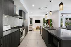 10 Mieke Court Burleigh Heads QLD 4220 $2,295,000 Positioned at the end of a quiet cul-de-sac, this large family home occupies an elevated 961m² block and offers space, privacy and a highly functional layout ideal for family living. With multiple living areas, generous proportions and excellent outdoor amenities, the home has been designed to comfortably accommodate growing or extended families. The residence comprises five well sized bedrooms, all with walk in robes. The master suite features a spacious ensuite with a custom barn style door, while the fifth bedroom on the lower level includes its own ensuite and is well suited to guests, teenagers or multi generational living. High ceilings and large windows enhance the sense of space and allow plenty of natural light throughout both levels. The home presents beautifully, with recent painting completed in the main living areas including the kitchen, living spaces and hallways, along with a modernised kitchen splashback. The kitchen is well appointed with a large island, stone benchtops, walk in pantry and stainless steel appliances, and connects seamlessly to the open plan living and dining area. Multiple living zones include an upstairs lounge, a downstairs media room and open plan family areas that extend to the covered alfresco entertaining space. Framed by lush landscaped gardens, the outdoor entertaining area overlooks the pool and decking, a generous grassed yard ideal for children, pets or a fire pit setting, and captures views out to the west with fantastic sunset views, creating a beautiful setting for relaxed evenings with family and friends. Additional features include zoned ducted air conditioning, 7.7kW solar panels and excellent vehicle accommodation. Along with the double garage, an additional driveway has been added to allow for boat and caravan parking. Located in a family friendly neighbourhood, parklands with a playground and basketball court are positioned at the end of the street. Old Burleigh Town is known for its quiet streets, walking tracks and proximity to local amenities, quality schools and direct access to the M1, providing seamless connectivity north and south. Burleigh Beach is also conveniently close by.