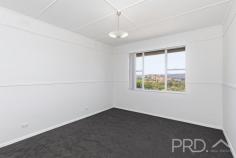 38 Sunnyside Avenue Batlow NSW 2730 $415,000 Positioned on the high side of Sunnyside Avenue and with an elevated aspect, you will love coming home to this fully renovated three-bedroom, two bathroom high-set home and take in the panoramic views. With three great sized bedrooms, two bathrooms and the living designed to take in the views and flowing seamlessly to your fully covered front deck. 38 Sunnyside Avenue is a fantastic opportunity not to be missed. Call today to book your inspection! Premiere Features: - Three great size bedrooms positioned to one end of the plan - Main bathroom also fully renovated with separate shower, bath, single vanity, shaving cabinet and toilet - Kitchen positioned to over look the rear yard with electric cooktop, timber bench tops, tiled subway splash back and ample cabinetry options including pantry - Open plan living and dining areas serviced by reverse cycle air conditioning, additional heater and direct external access to the front deck - Combined laundry and second bathroom with additional second toilet and shower, vanity and shaving cabinet, all positioned to the rear of the plan - Great size fully covered front deck, perfect for taking in the panoramic views from the elevated positioning - Quaint rear entertaining - Great sized rear yard with additional garden shed - Single lock up garage with secure storage option positioned under the home - Approximate 683m² allotment The property has been fully renovated inside and out and is a fantastic opportunity to move straight in and capitalise on the elevated positioning in the picturesque town of Batlow.