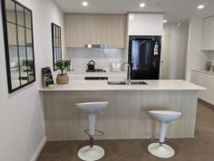 1201/5 Second Avenue Blacktown NSW 2148 Welcome to this stunning 2-bedroom, 2-bathroom apartment located at 1201/3-5 Second Avenue, Blacktown. This modern unit features a spacious living area, a stylish kitchen with high-end appliances, and a balcony with views. The master bedroom includes an ensuite and a built-in wardrobe, while the second bedroom has access to the main bathroom. There is also security basement parking and lift access to each floor. Other features include quality bathrooms, gas cooking and intercom security. Designed to provide a premium living experience in the heart of Blacktown. This is the Luxury in urban apartment style with high-end finishes, generous proportions and a striking architect design, with capturing panoramic views around the city skyline. With a garage space included, this apartment is perfect for those looking for convenience and comfort. The building itself offers a contemporary design and is situated in a prime location close to shops, restaurants, public transport and Blacktown Station. Located within short walking distance to Blacktown Westpoint Shopping Centre and the train station, This property is ideally positioned for lifestyle with all amenities at your doorstep. Property Features Include; Level 12 apartment 2 bedrooms with built-in wardrobes, with the main bedroom includes en-suite Intercom system Modern bathroom with laundry, which includes a dryer Split system air conditioner Modern Kitchen with brand new stainless steel appliances, including dishwasher Formal lounge room Carpet throughout 1 car space Close to schools, shops and transport
