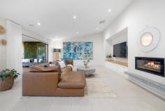 2 Bronzewing Court Langwarrin VIC 3910 $1,690,000 - $1,850,000 Positioned within a peaceful pocket of Langwarrin, this extensively renovated residence delivers spacious family living with the added advantage of a fully self-contained attached unit, creating exceptional flexibility for extended family, guests, home business use or additional accommodation. Set on a prominent corner allotment with two separate driveways and individual entrances, the home immediately impresses with its freshly painted rendered façade, landscaped gardens, established yucca trees and manicured surrounds. Inside, a welcoming tiled entry introduces thoughtfully designed interiors enhanced by LED downlights, ducted heating and evaporative cooling throughout. The front formal lounge provides a quiet retreat with soft carpeting, sheer curtains and abundant natural light, while the expansive open-plan living and dining domain forms the heart of the home beneath vaulted ceilings and skylights. A wood-burning fireplace creates warmth and ambience, complemented by a custom built media unit with timber finishes. The renovated kitchen combines functionality with contemporary style, appointed with waterfall stone benchtops, breakfast bar seating, gold fixtures, extensive cabinetry, integrated Bosch dishwasher and premium ILVE cooking appliances including a gas cooktop, grill and oven. Privately positioned, the spacious master suite features a double-door entry, ceiling fan, walk-in wardrobe with mirrored sliding doors and a beautifully appointed ensuite complete with dual vanities and oversized double shower. Additional bedrooms within the main home include built-in robes and are serviced by a renovated central bathroom showcasing a freestanding bath, floating vanity and rainfall shower. A standout feature of the property is the attached self-contained unit with its own driveway, garage and private access. Designed for flexibility, the space includes a kitchen with induction cooking, living and dining area, split-system heating and cooling, bathroom/laundry, generous bedroom with extensive built-in robes and an additional room suitable as a study or second bedroom. Outdoor living is equally impressive with covered alfresco entertaining areas servicing both the main residence and the separate accommodation. Decking, café blinds, ceiling fans and established tropical-inspired landscaping create inviting spaces for year-round enjoyment, while additional features include AstroTurf, a water feature, water tank and storage shed. Conveniently located close to Langwarrin Flora and Fauna Reserve, Peninsula Private Hospital, Langwarrin Primary School, Elisabeth Murdoch College, Ballam Park, Lloyd Park, Frankston Golf Club, Karingal Hub, The Gateway Shopping Centre and easy access to Peninsula Link.