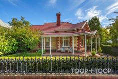 145 Hill St North Adelaide SA 5006 $4,750,000 A stunning architectural renovation has added an outstanding level of contemporary sophistication to this magnificent freestone fronted return veranda villa with pool, situated in one of North Adelaide’s beautiful wide tree lined streets. Original period details have been retained, restored, and enhanced by high-end modern styling. A floorplan of generous proportions offers versatile family living and can be adapted as desired. A gracious formal sitting/formal dining room with box bay window, and handsome library/study, both feature original fireplaces with instant gas-fires, and a wide stylish entrance hall boasting high ceilings, polished boards and impressive decorative arch sits between. Up to five bedrooms lead from the long light filled hallway with sweeping modern living and garden views beyond. The elegantly disposed master enjoys convenient veranda access, walk in dressing room, and large clean-line ensuite with under-floor heating. Another bedroom also with walk-in robe and light filled ensuite is perfect for guests or teenagers. Further well designed features include a family bathroom with freestanding bath and underfloor heating; powder room; large laundry; dry cellar with up-lit stairs. Side entry access to both the rear yard and to a delightful private sunny service courtyard. There is associated secondary access to a secure garage with auto tilt door and undercover parking for 2 cars and with extensive built in storage. One is struck by light and space in the sensational open plan casual living expanse bound by glass. A four-metre long Ceasarstone island bench connects the sleek entertainer’s kitchen incorporating Subzero fridge and Smeg appliances. Banks of sliding stack doors extend indoor living to a wide elevated wrap-around deck with built in Weber BBQ and 2 drawer subzero fridge, perfect for poolside entertaining and relaxation. The tiled pool is fitted with a heat pump and fully fenced and bound by citrus, bay trees and lawn, with hedging and tree studded vistas beyond. ADDITIONAL FEATURES OF NOTE: • Subzero fridge and Smeg appliances in kitchen • Reverse cycle air-conditioning two units for front section, third unit for rear extension • Gas fireplaces to the dining room and library • Wired bose sound system to back extension and outdoor speakers over deck • Underfloor heating to the ensuite bathroom and family bathroom • Dry cellar • Extensive storage • Alarm system, security cameras to the rear lane, garage and rear garden • Subzero two door drawer fridge in built-in barbecue Unit • Weber barbeque with plumbed gas • Saltwater chlorinated pool with heat pump and pool lights • 24 kW solar system to roof with 7.5 kW Tesla battery • Valuable side lane with garage • Automatic irrigation to front and rear garden with garden lighting • Rear garden access and tool shed LOCATION & LIFESTYLE: Minutes from the city, parklands, cosmopolitan O’Connell St, Adelaide Oval. This is a truly exceptional offering for the most discerning buyer. EDUCATION: Zoned for Adelaide Botanic High, Adelaide High, North Adelaide Primary and close to some of Adelaide’s premier private schools.